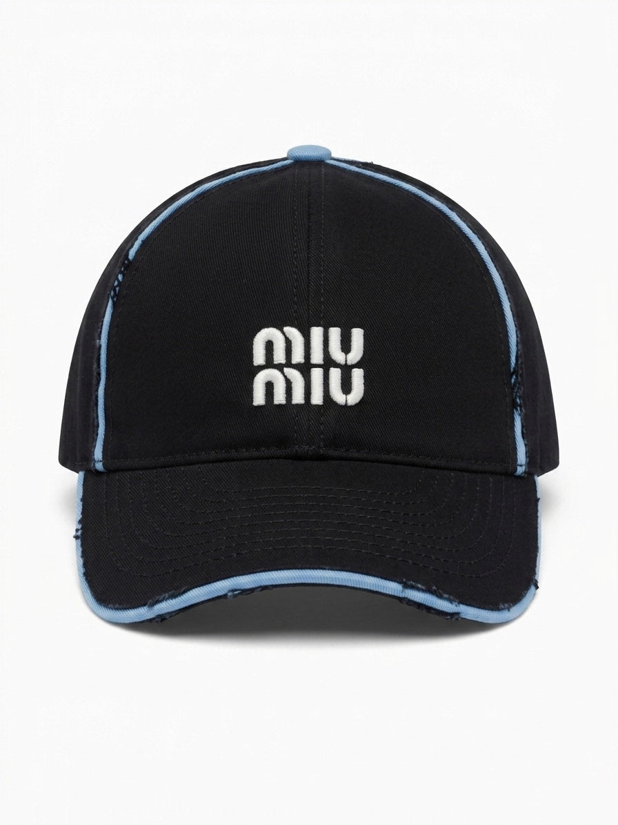 MIU. Distressed Canvas Baseball Cap in Nero/Celeste