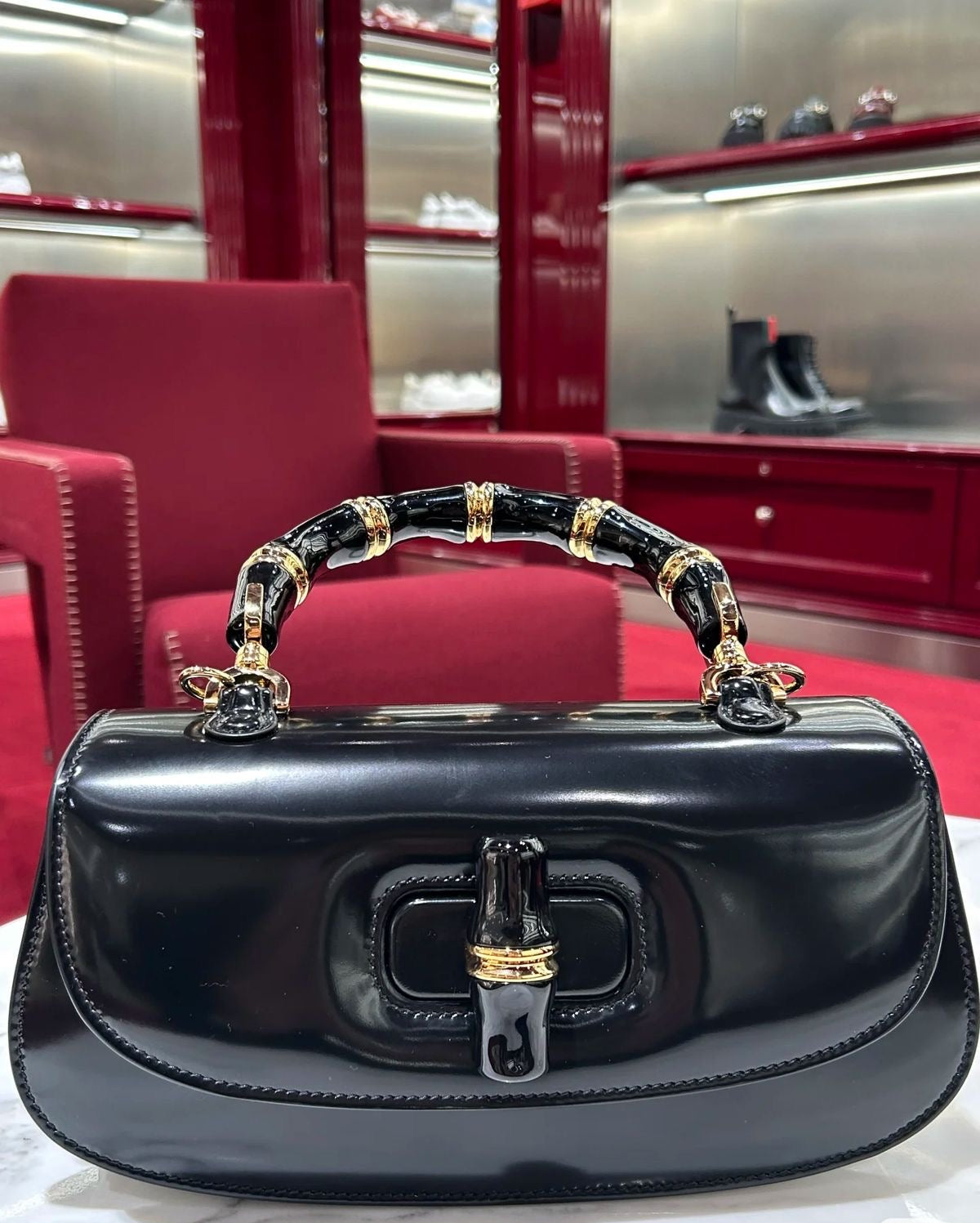 Glossy Patent Leather Top-Handle Bag with Sculpted Accents