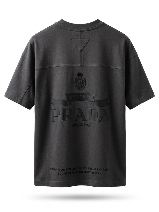 The P. Signature-Emblem Oversized Tee in Deep Charcoal.